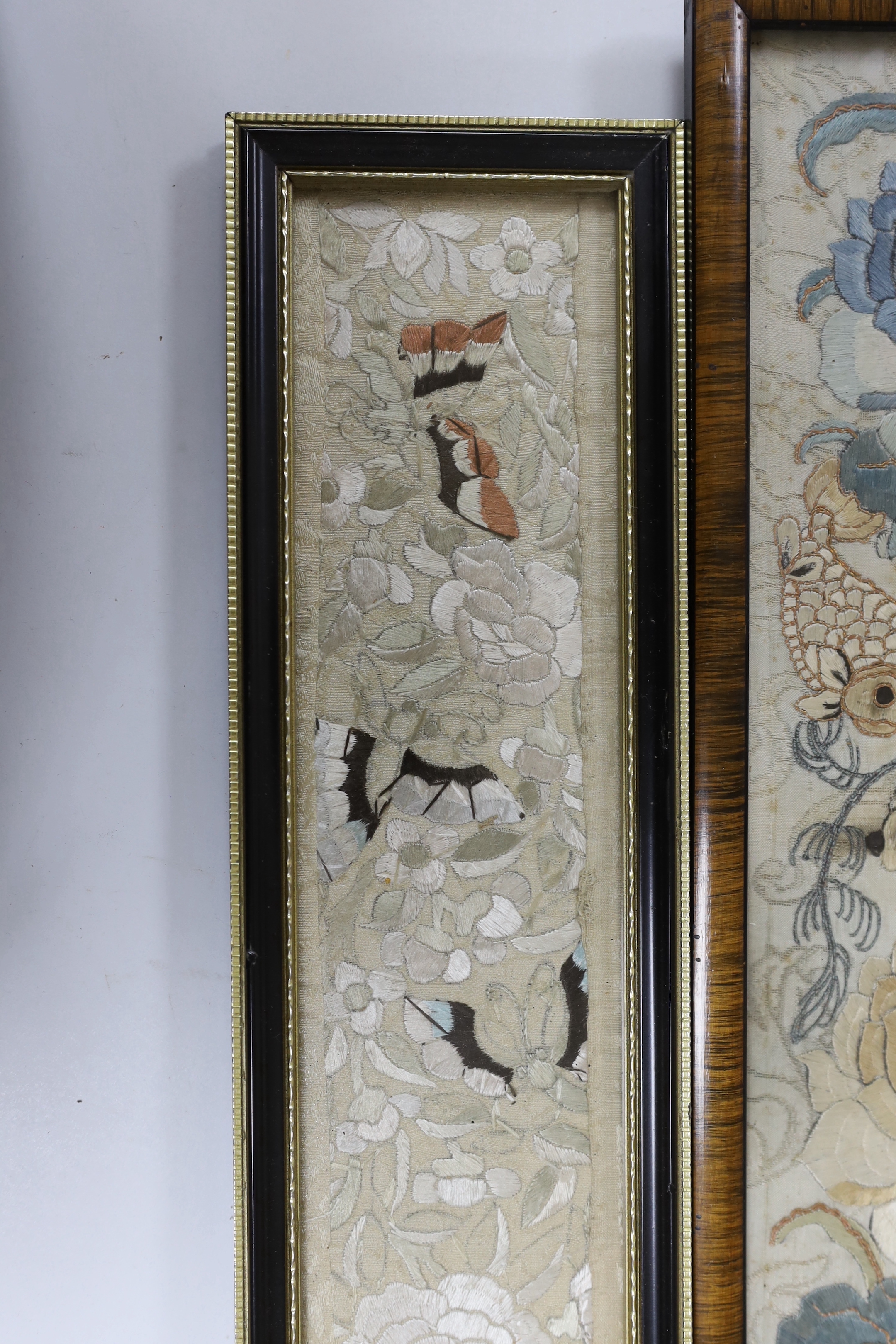 Three 19th century Chinese framed silk panels with embroidered decoration, largest 12 x 55cm